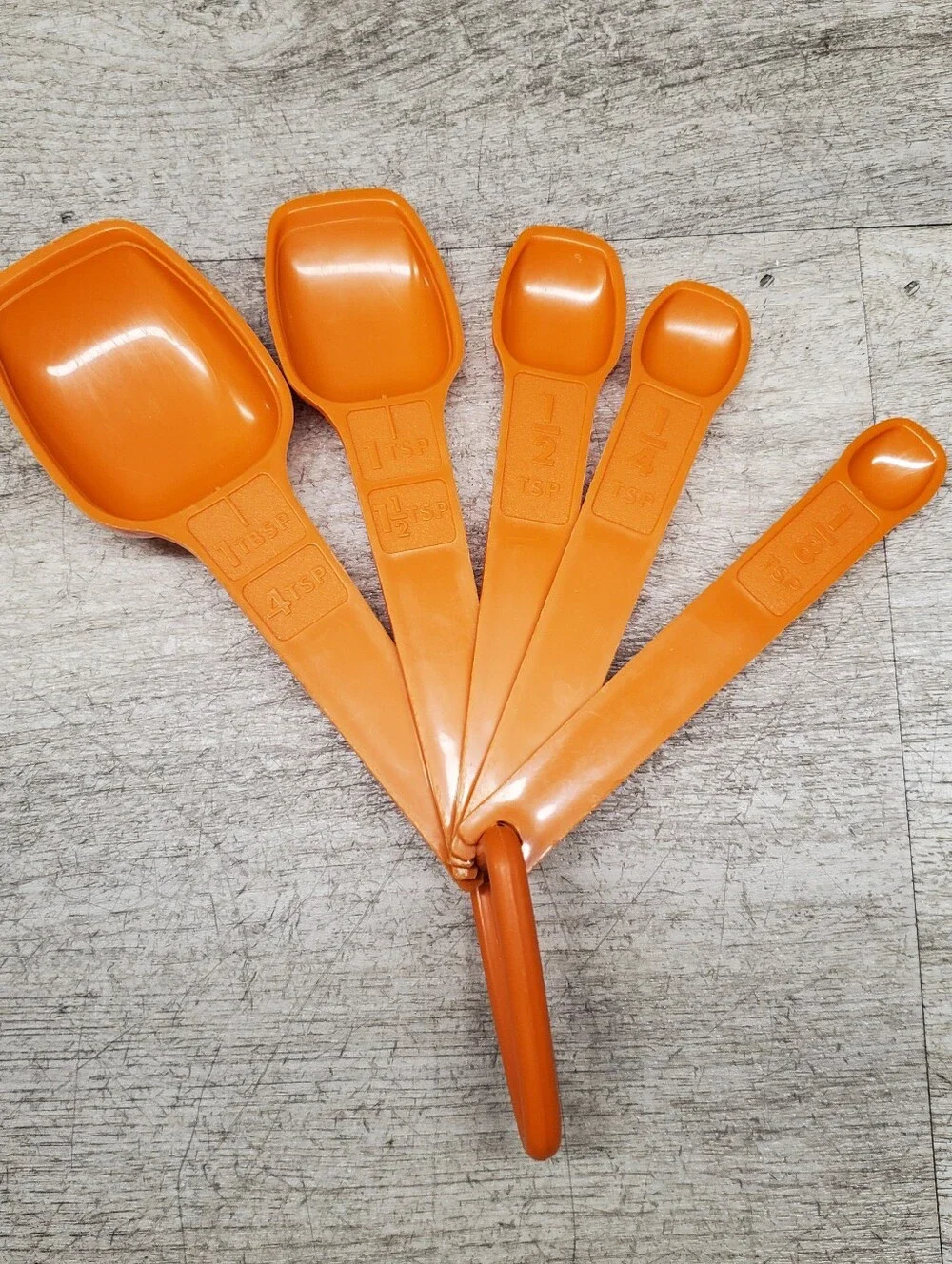 Vintage Tupperware orange measuring spoons